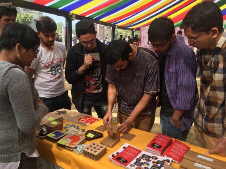 A group of visitors trying their hand at Pentominoes challenge cards at the Maker fest, Ahmedabad, 2016