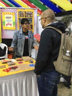 Engaging in a conversation with a bio-scientist at the Maker fest, Ahmedabad, 2017