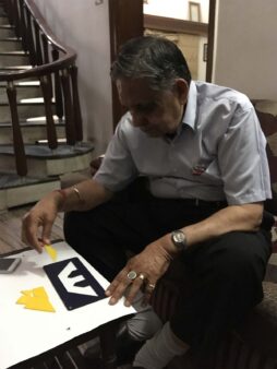 My 85 year old grandfather exercising his mind with a Tangram Puzzle