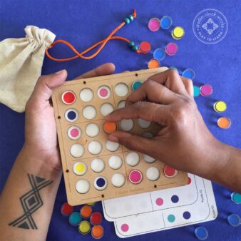 Six Colour Sudoku with interchangeable challenge cards that slide into the tray with pop candy coloured game pieces